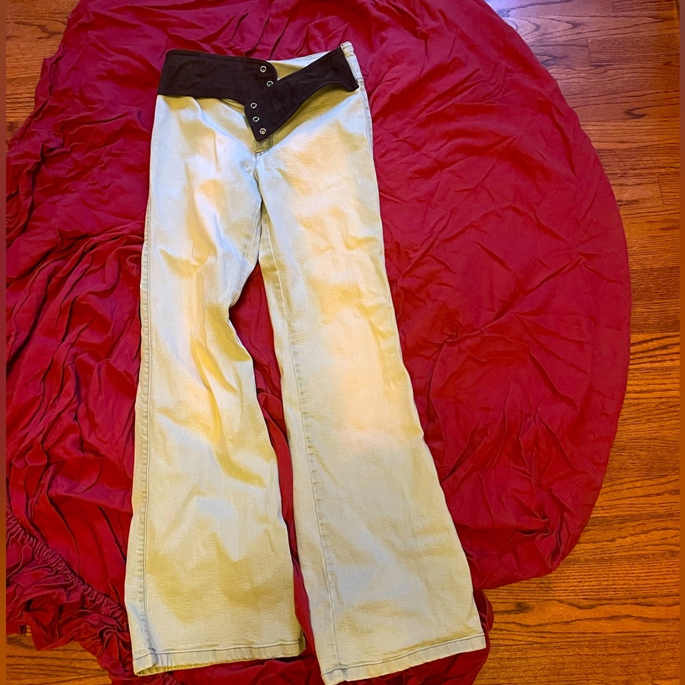 Very light blue jeans with faux brown suede waist